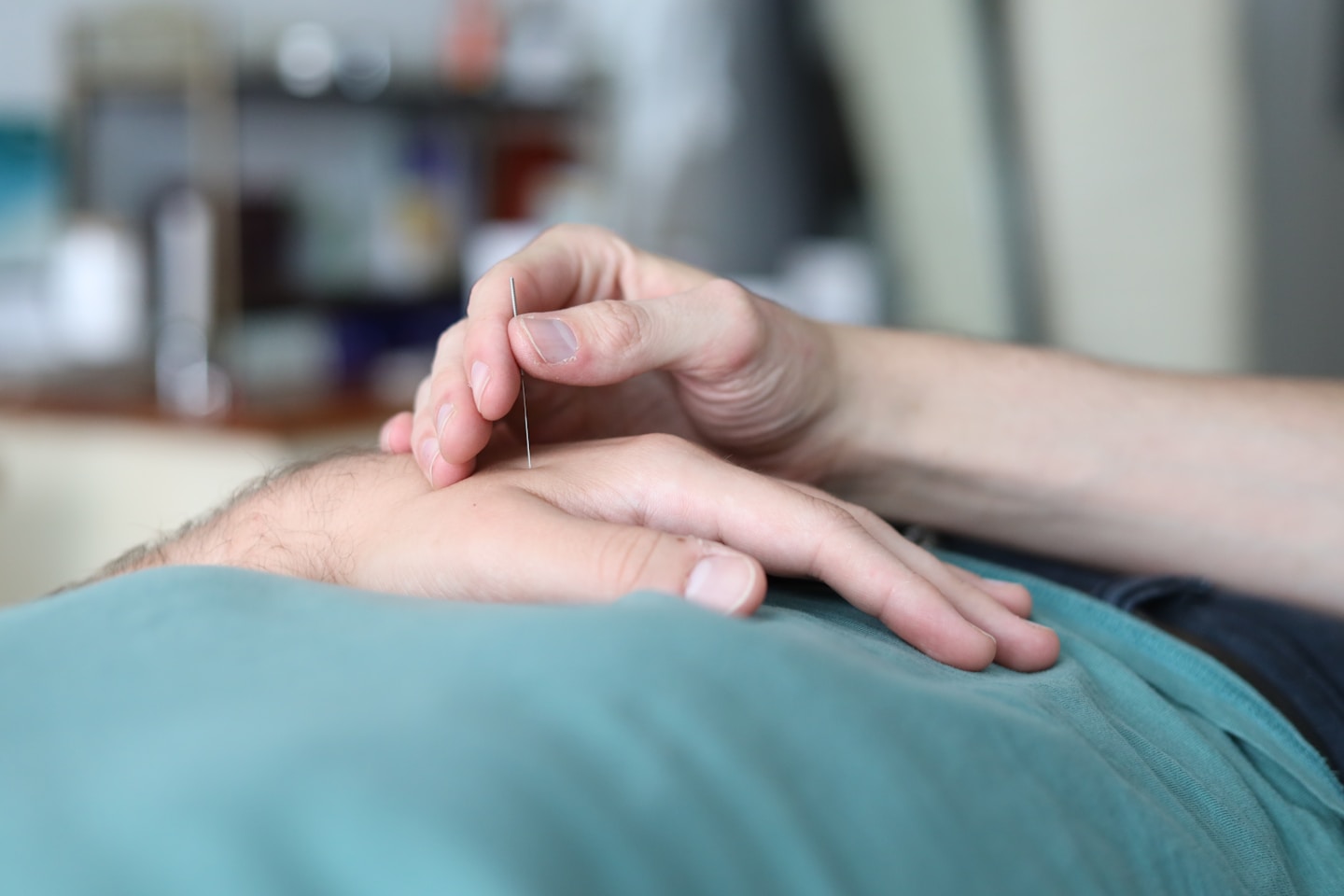 A person is holding the hand of another person